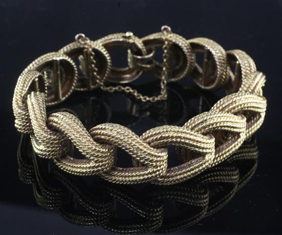 A Swiss 18ct gold textured pear shaped link bracelet.